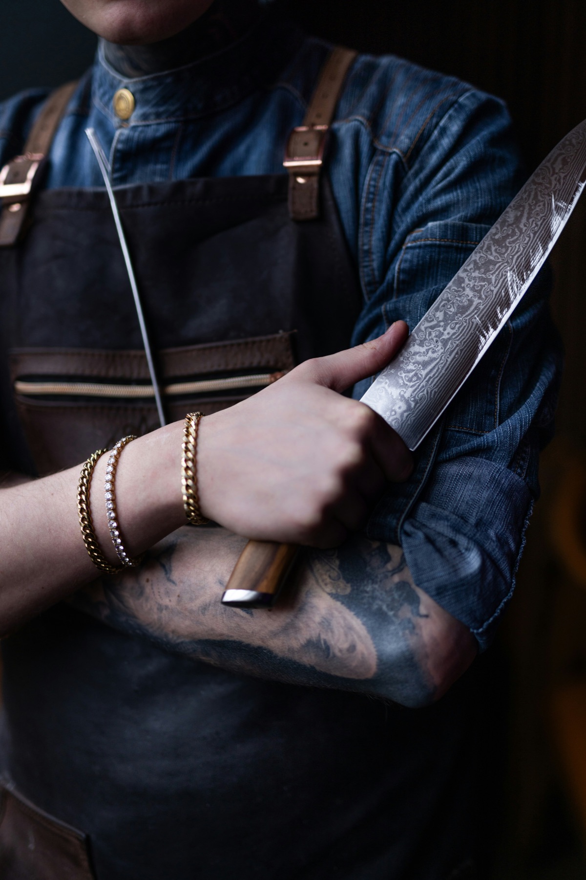 Chef Kenji Mori holding his damascus knife