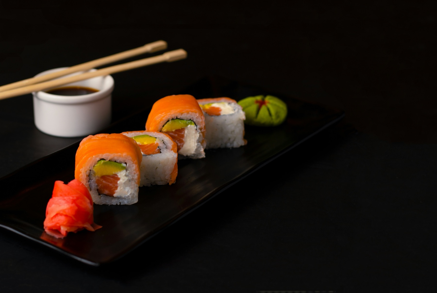 Salmon wrapped rolls with wasabi and ginger